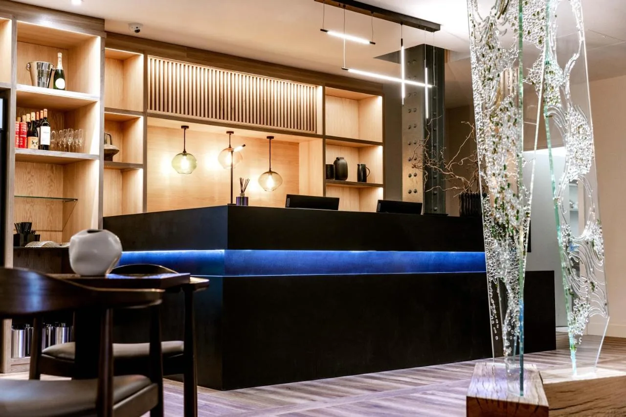a lobby of a restaurant with a blue bar at School Lane Hotel in Liverpool ONE in Liverpool
